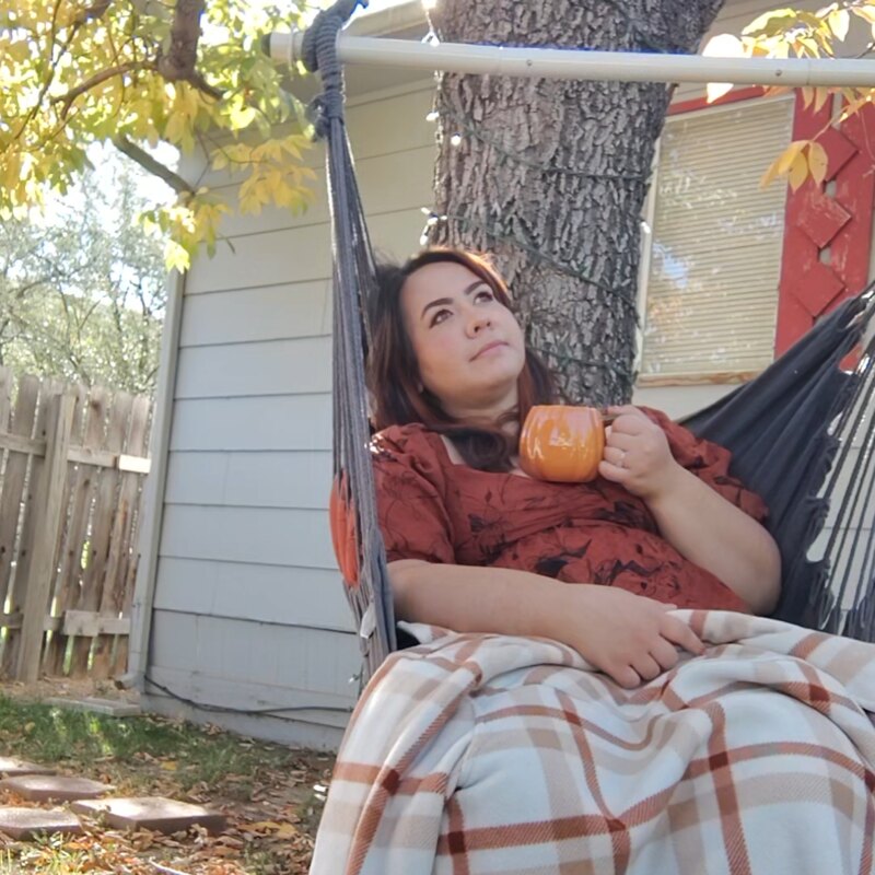 Katie relaxing with a warm mug